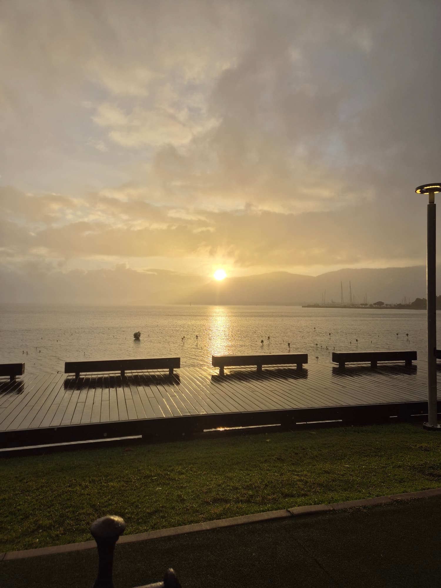 Breathtaking sunrise over Cairns Esplanade and Trinity Bay, showcasing the natural beauty of Far North Queensland where HansenDev provides web development and AI integration services to local businesses